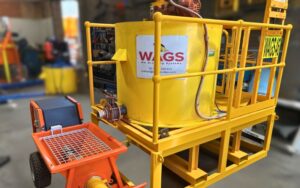 WAGS 1000 litre poly mixing system with safety grates and attached pump equipment.