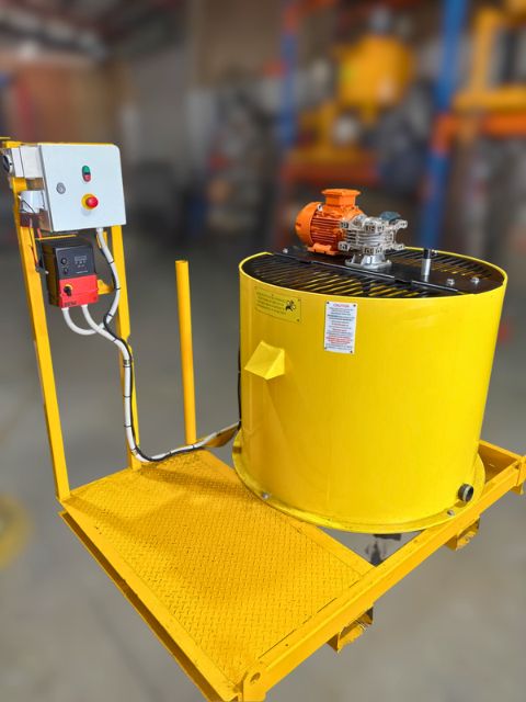 Yellow 1000 litre paddle mixer with electric motor and control panel