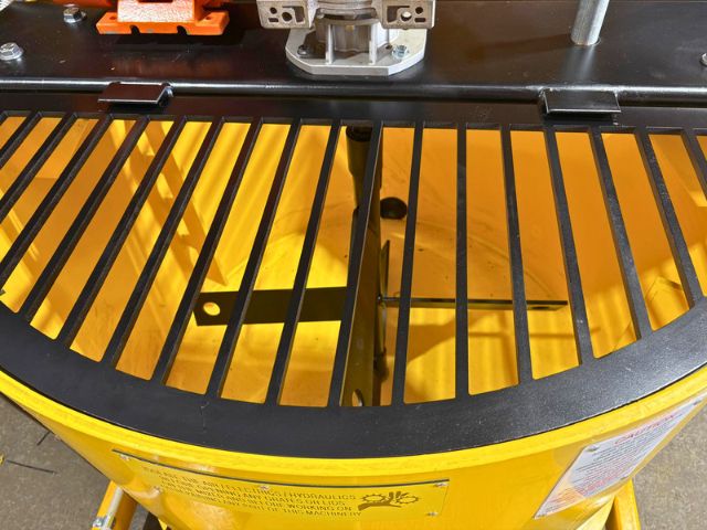 Safety grate and internal paddle inside a yellow 1000 litre poly paddle mixer