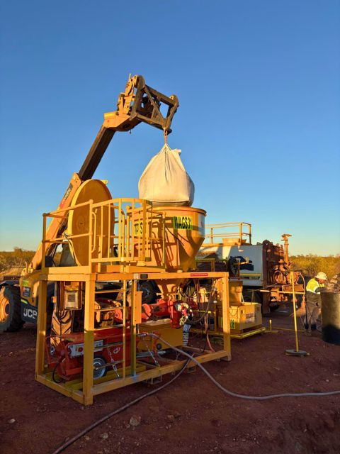 WAGS CM180 grout station being loaded onsite WAGS CM180 grout station receiving dry grout material from a suspended bulk bag onsite.