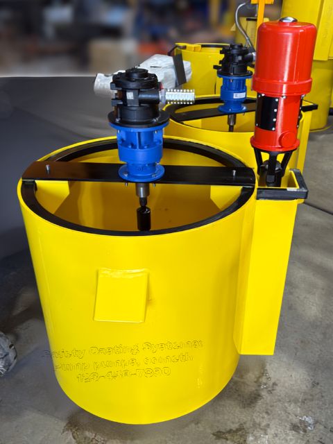 A B150b air powered grout pump is shown mounted beside a yellow poly mixing bowl with a black safety grate and drive unit. This image supports the Grout Pumps page by showing the pump and mixing bowl setup used for grout mixing and pumping, with rugged construction suited to harsh mining conditions.