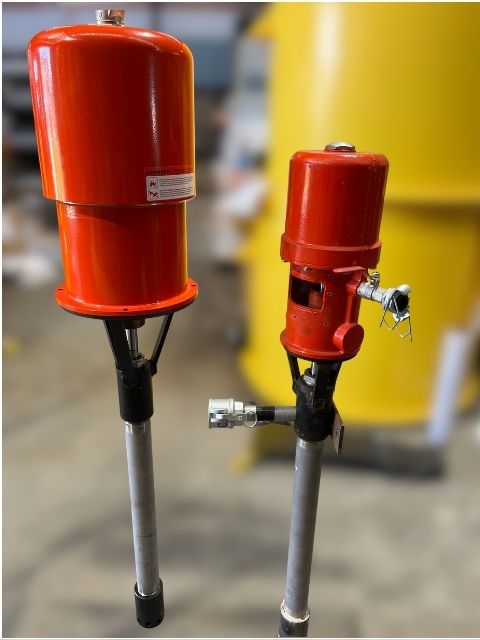 Close-up comparison of two B150b air powered grout pump units.